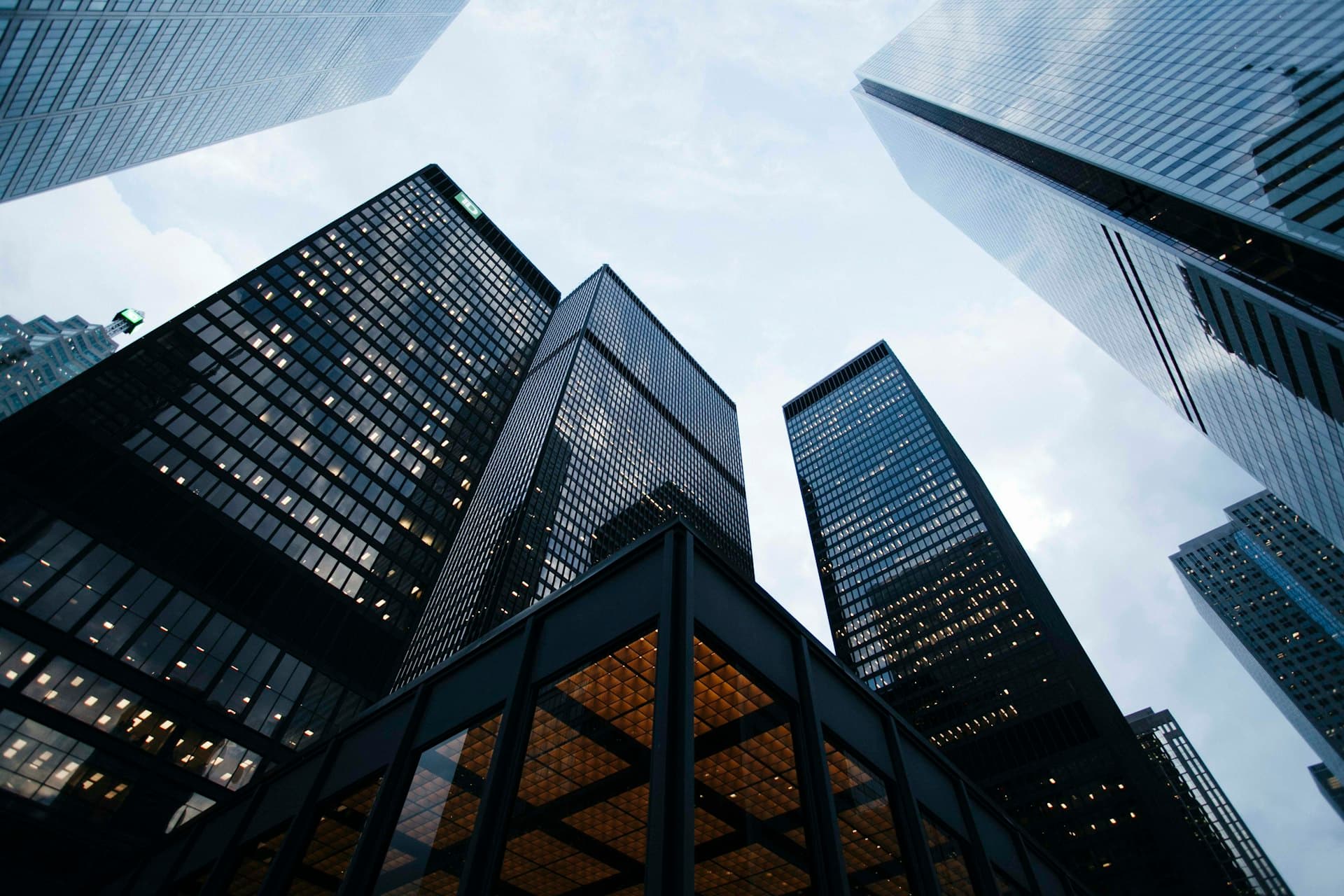Modern glass skyscrapers against a blue sky