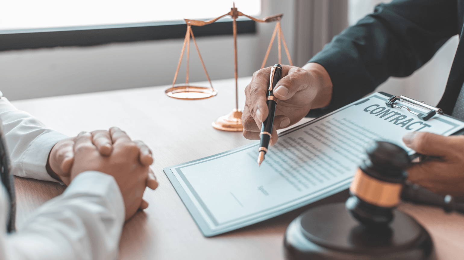 Attorney consulting with client across a desk